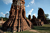 Ayutthaya, Thailand. Wat Mahathat, three auxiliary prang lined North South along the western enclosure wall of the main prang. 